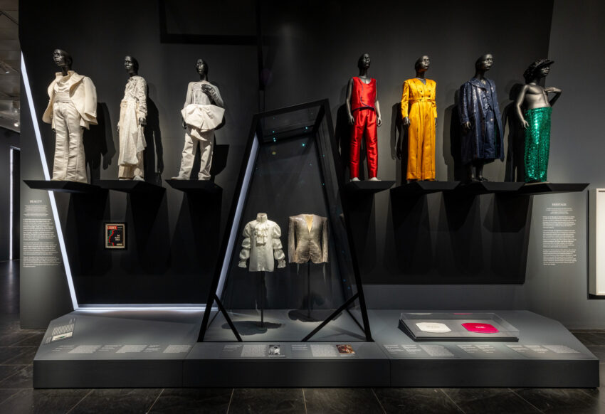 Flamboyant men’s fashions modeled on mannequins in the “Beauty” section of the Met’s Superfine exhibit