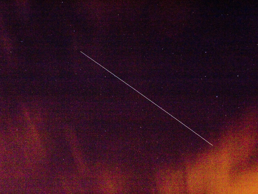 abstract image of white line through purple gradient towards orange at the bottom