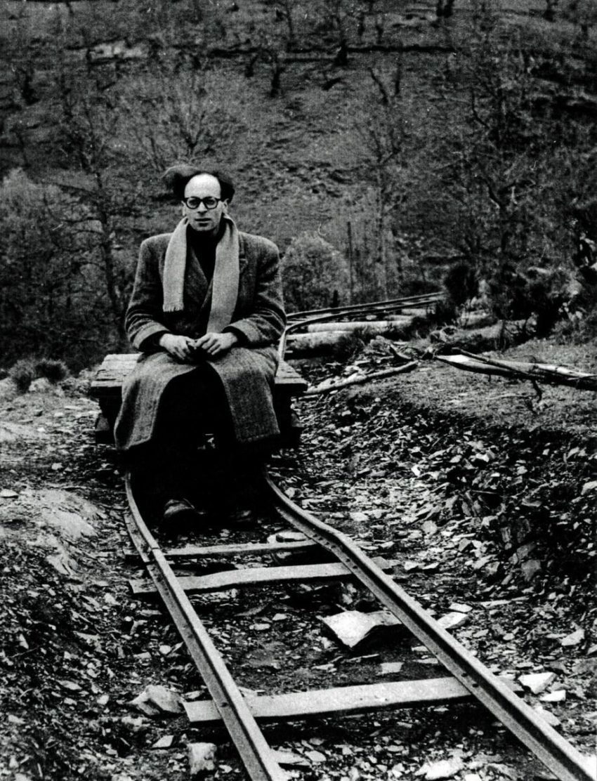 black and white photo of Kaminsky sitting on a bench