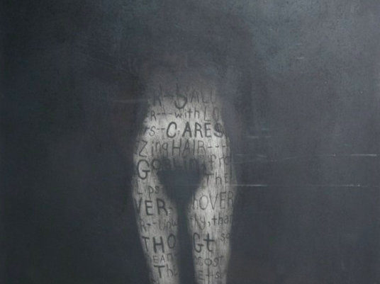 Obscured female form with words