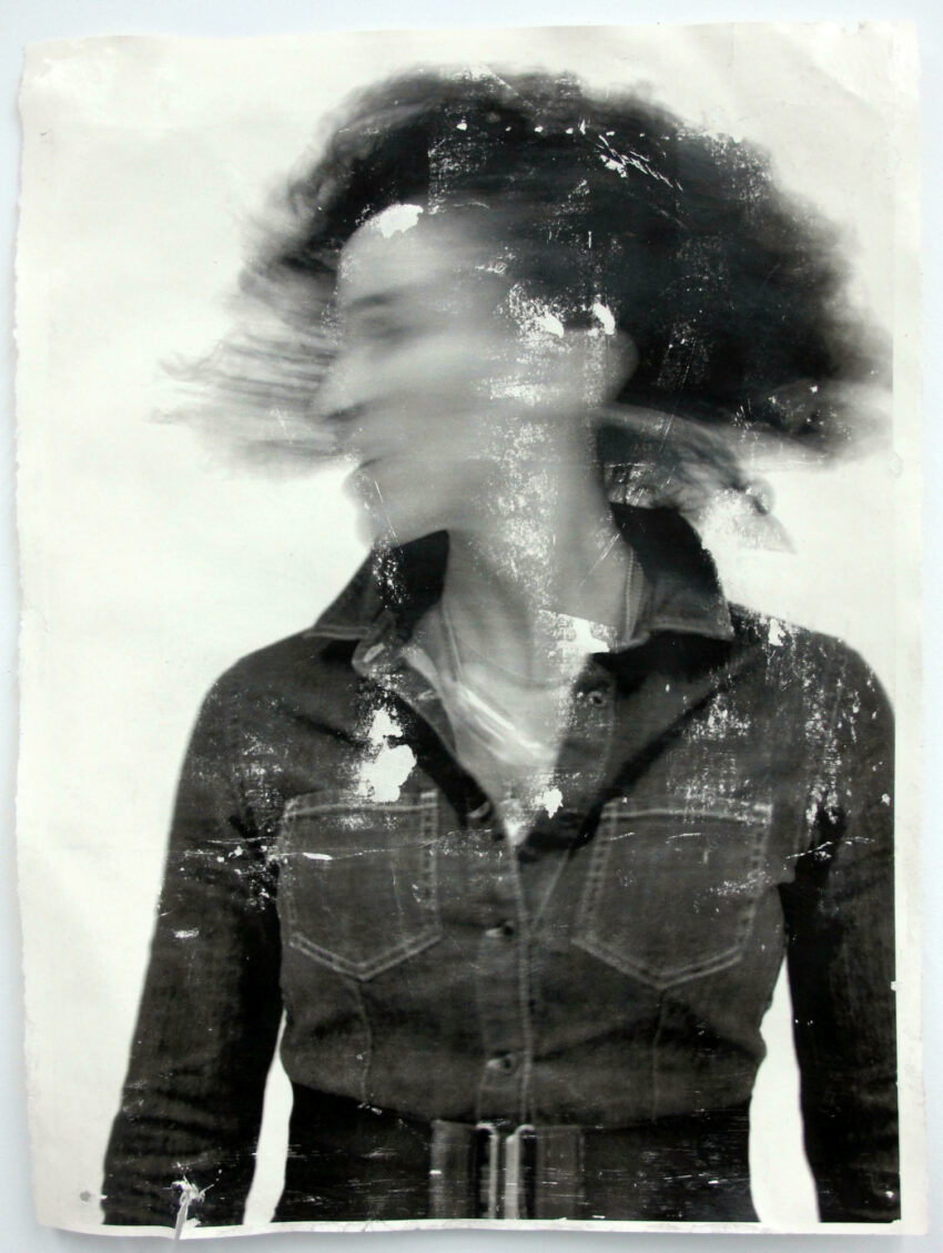 Blurry black and white photo of a woman.