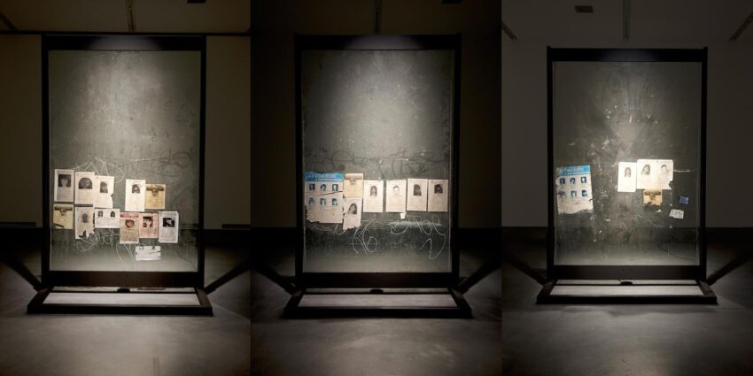 Installation view with missing person photos.