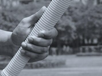 hand holding a cricket mallet.  Photo: Yogendra Singh.