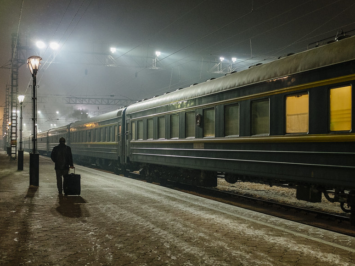 A photograph of a train station in Russia at night.